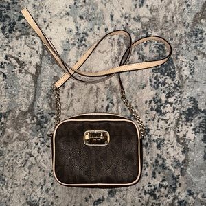 Michael Kors mini monogram crossbody bag.